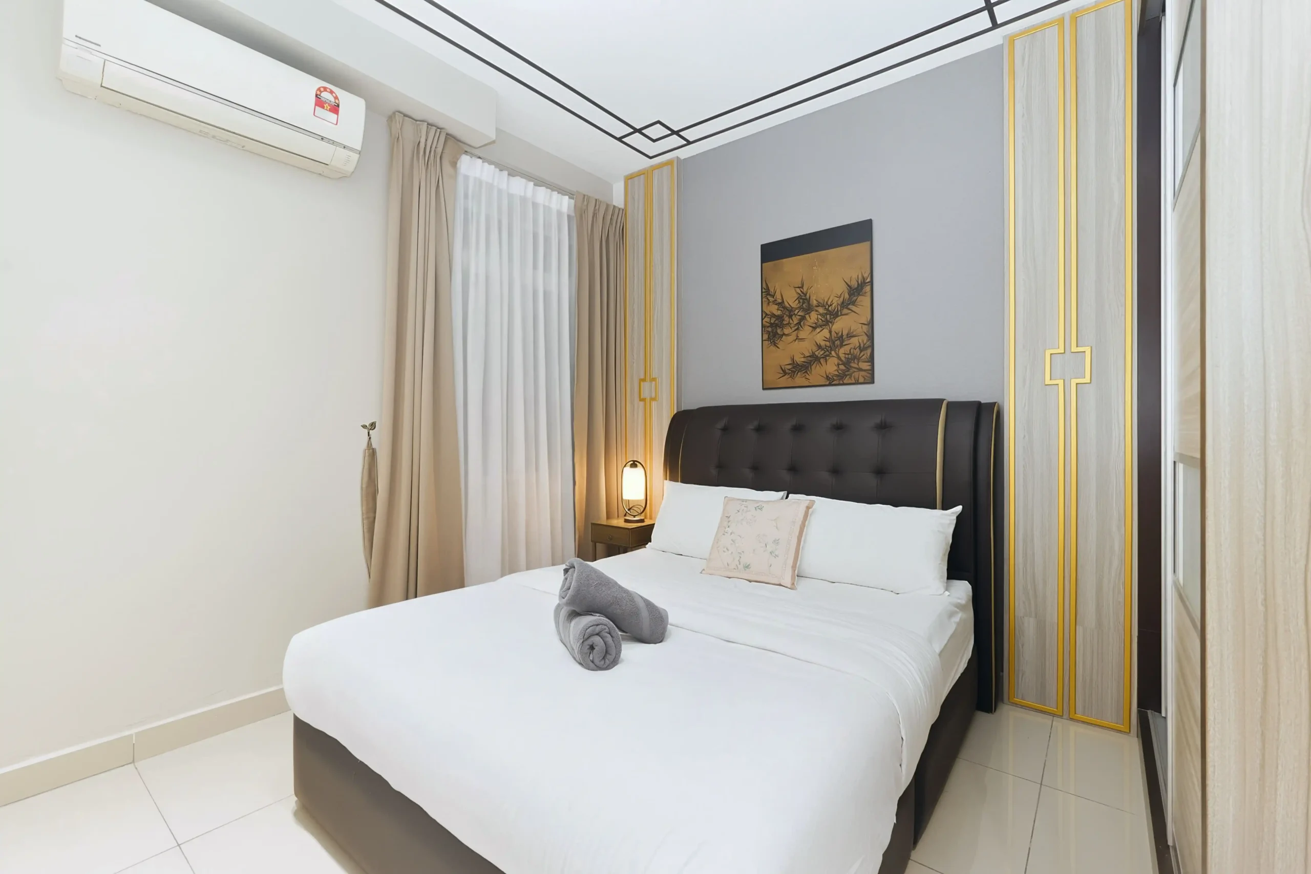 Second bedroom featuring a cozy queen-size bed and air conditioning in Ipoh