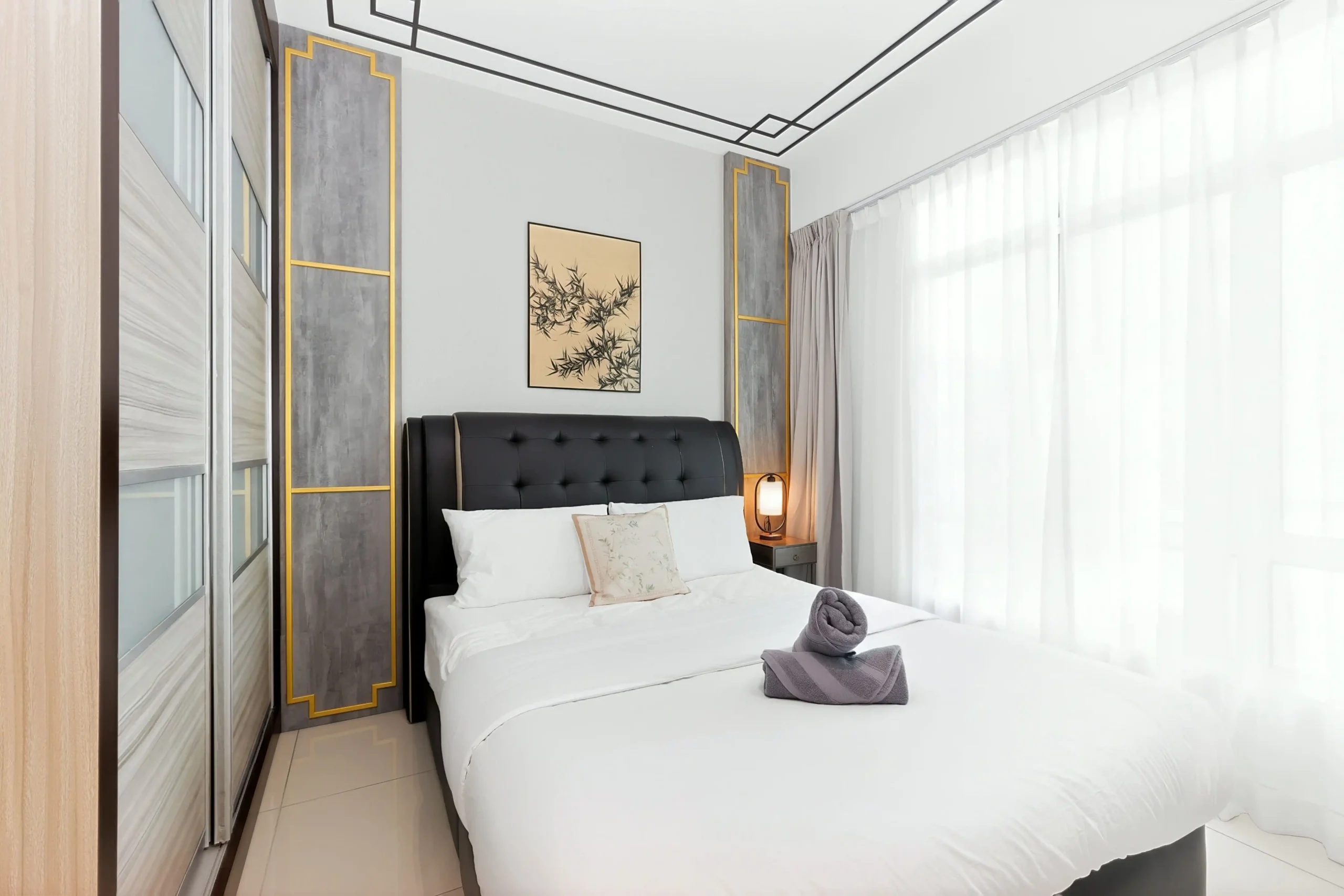 Warm ambient bedside lighting and wardrobe storage in master bedroom