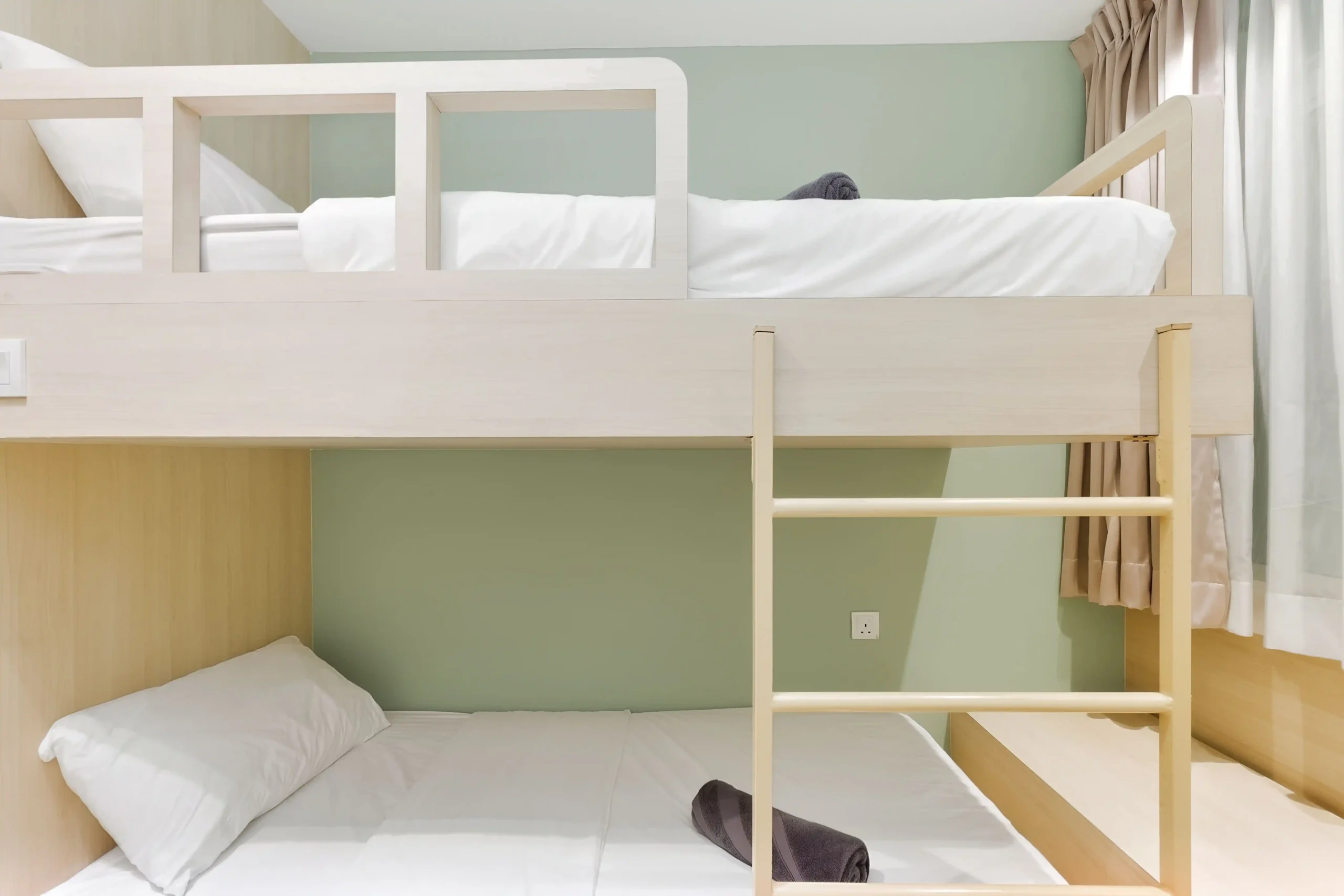 Cozy double decker bed setup accommodating 2 guests in air-conditioned room