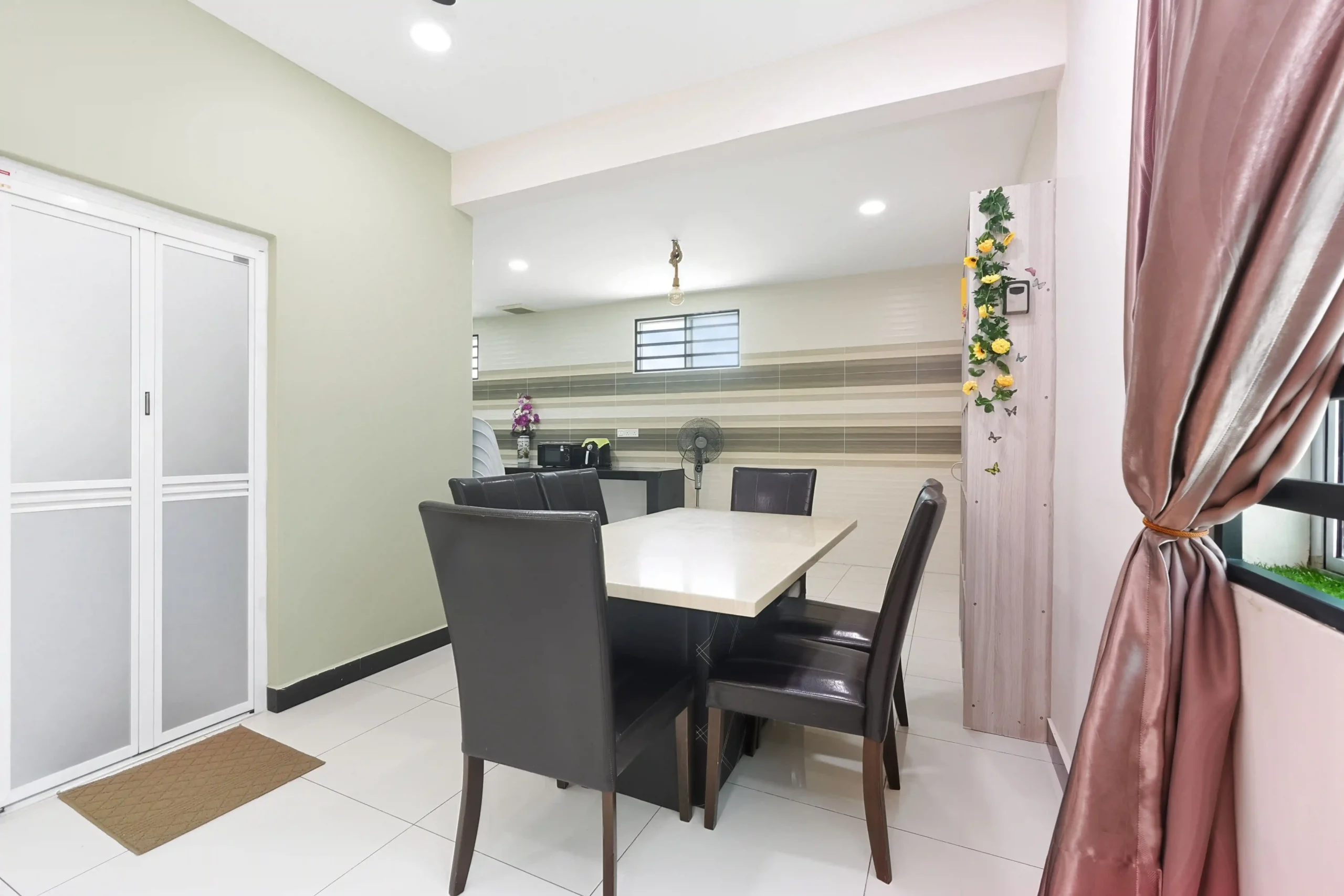 Dining area with 6-seater dining table for family meals in Ipoh
