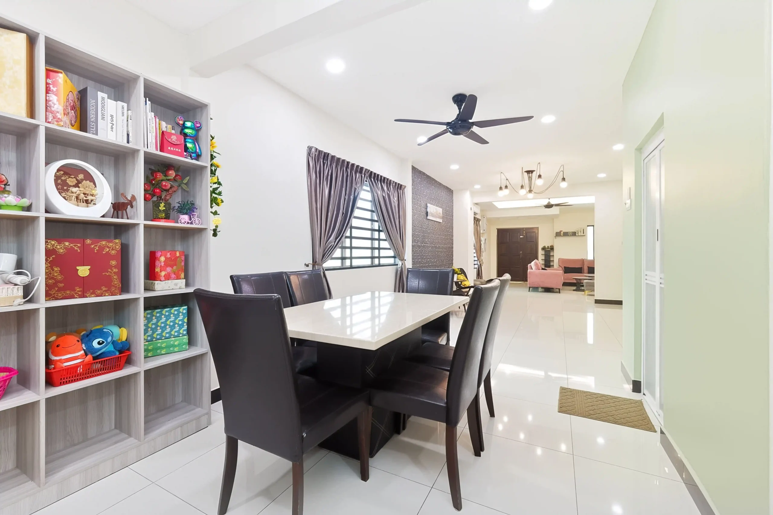 Well-lit dining space adjacent to kitchen in Ipoh event homestay