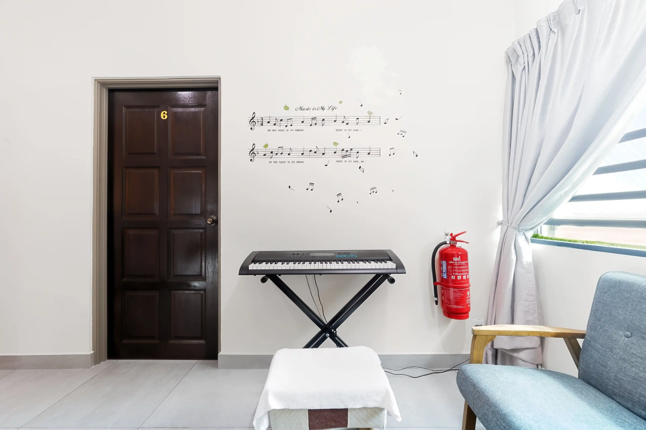 small living room with piano