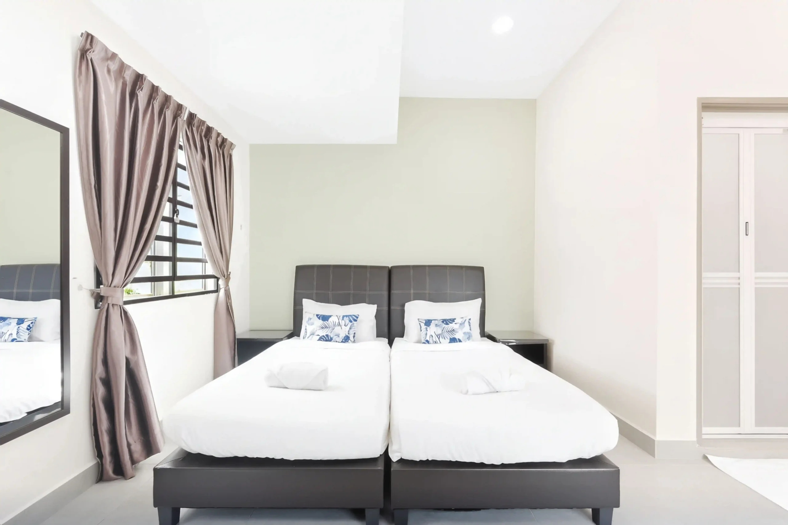 Clean twin bedroom layout at 7-bedroom event rental house in Ipoh