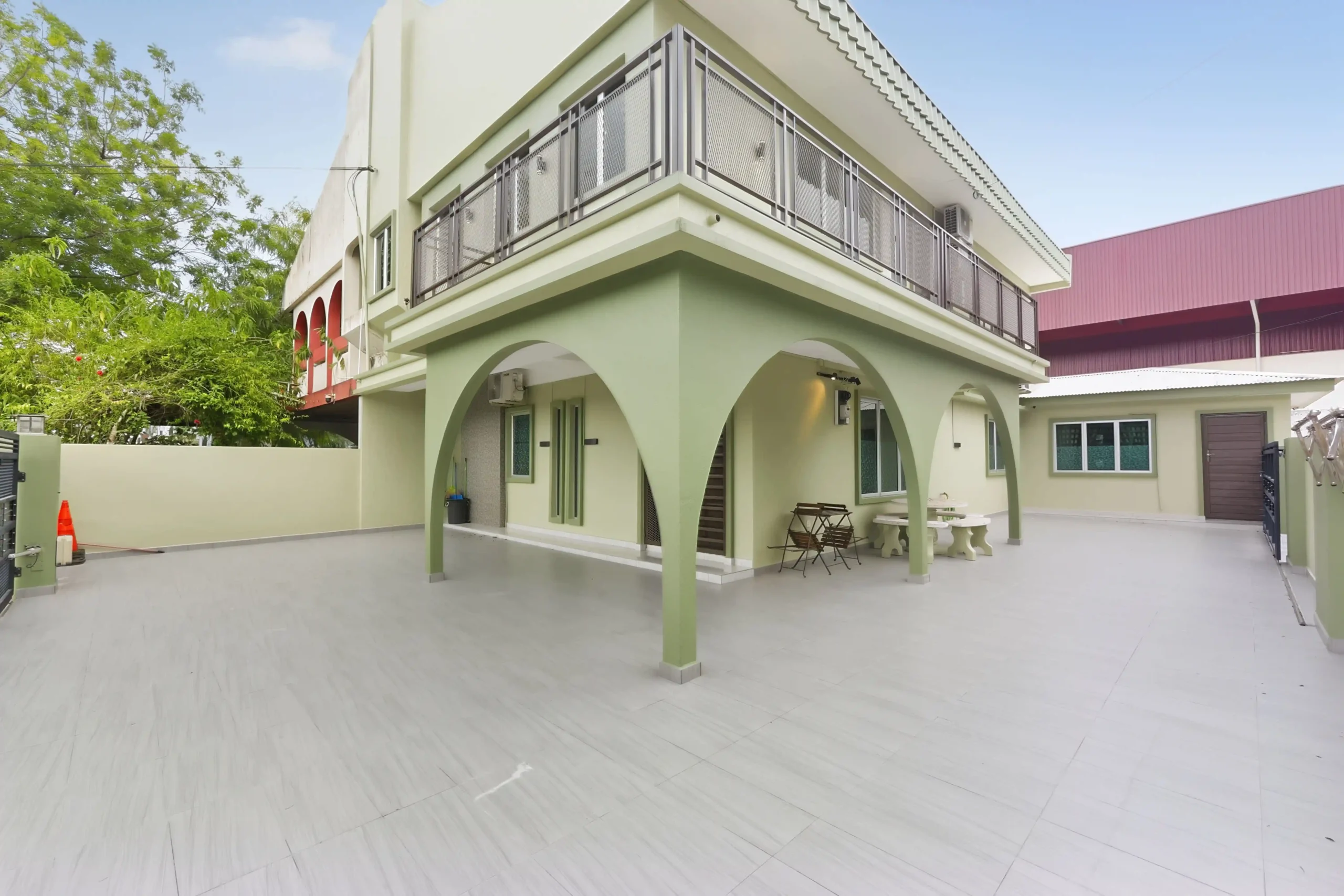 Modern pastel exterior of 7-bedroom Semi-D event homestay in Ipoh